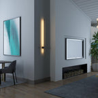 Linear LED wall light mounted vertically with a soft warm glow