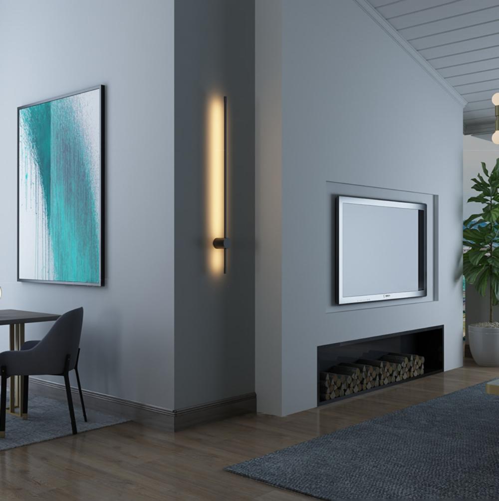 Linear LED wall light mounted vertically with a soft warm glow
