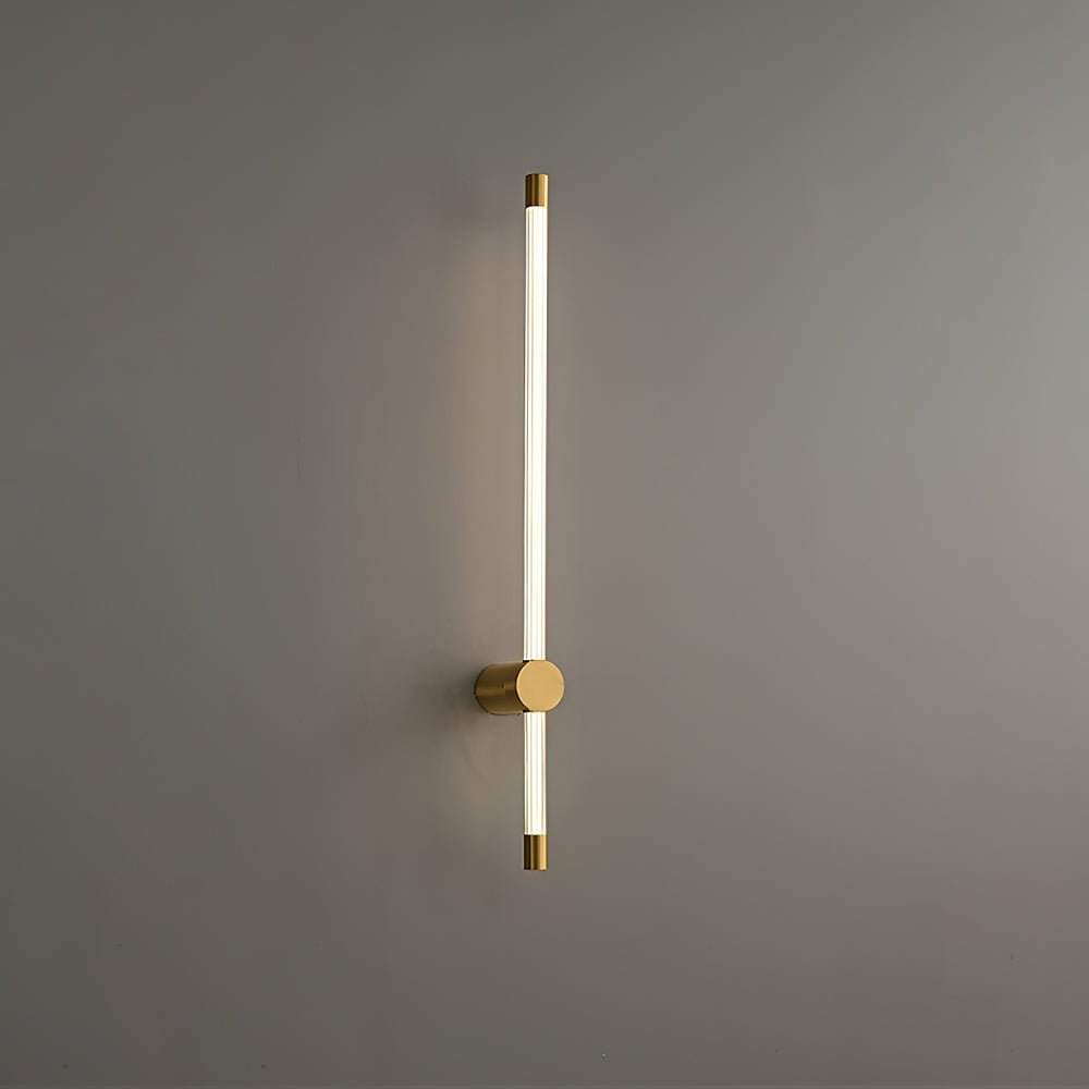 Vertical metal and acrylic wall sconce with warm glowing line