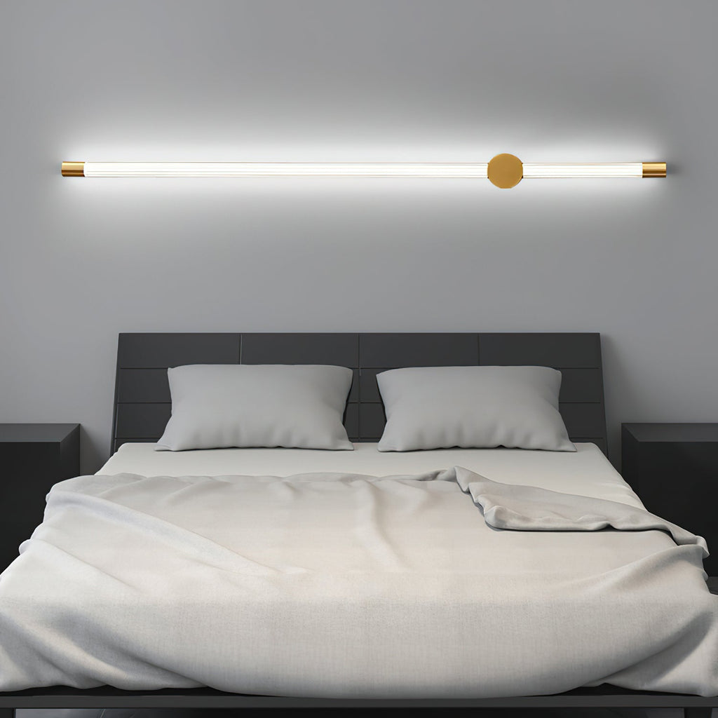 Copper linear LED wall sconce mounted on a quiet wall