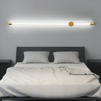 Copper linear LED wall sconce mounted on a quiet wall