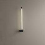 Linear LED wall sconce casting an even wash up the wall