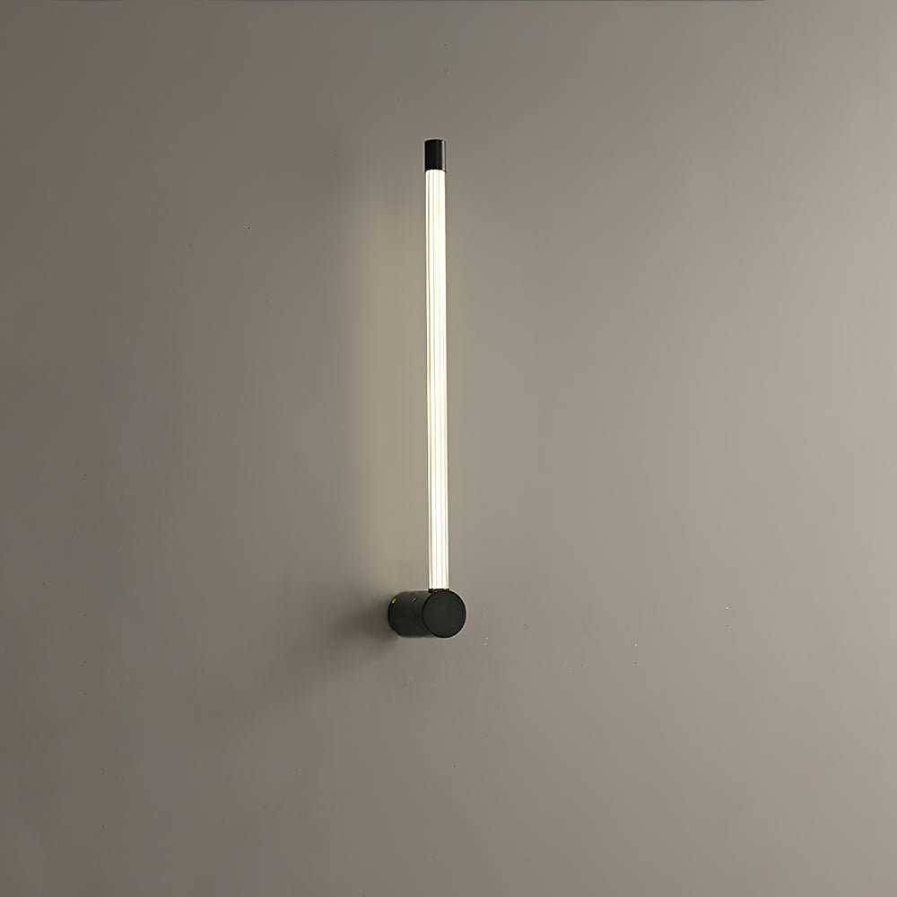 Linear LED wall sconce casting an even wash up the wall