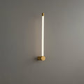 Slim linear LED wall sconce glowing in a soft vertical line