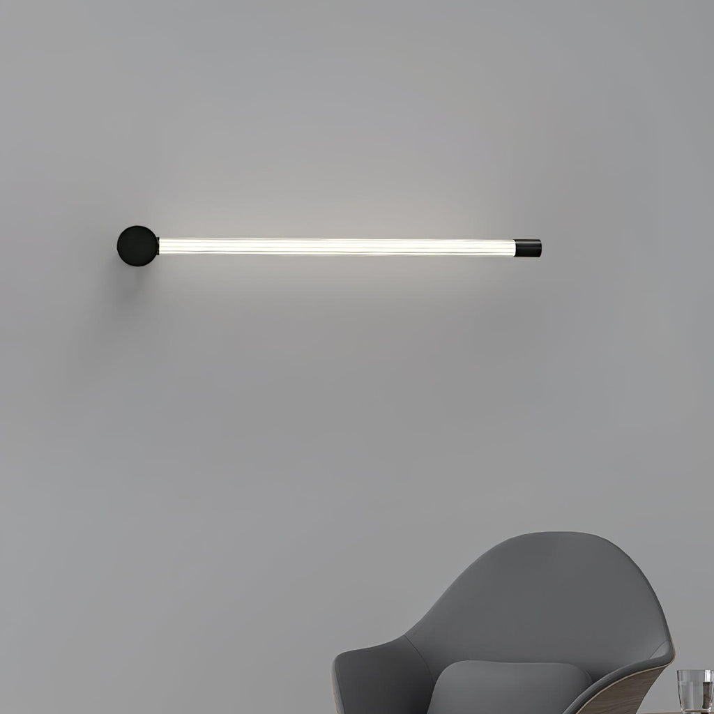 Slim linear wall sconce washing soft light across the wall