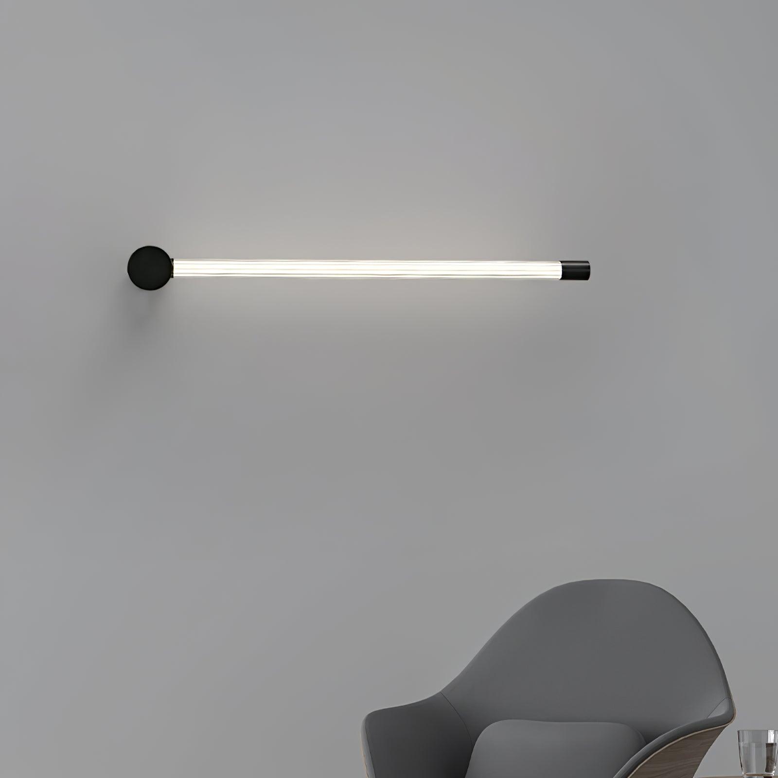 Slim linear wall sconce washing soft light across the wall