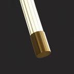 Linear LED wall sconce glowing warm in a styled interior