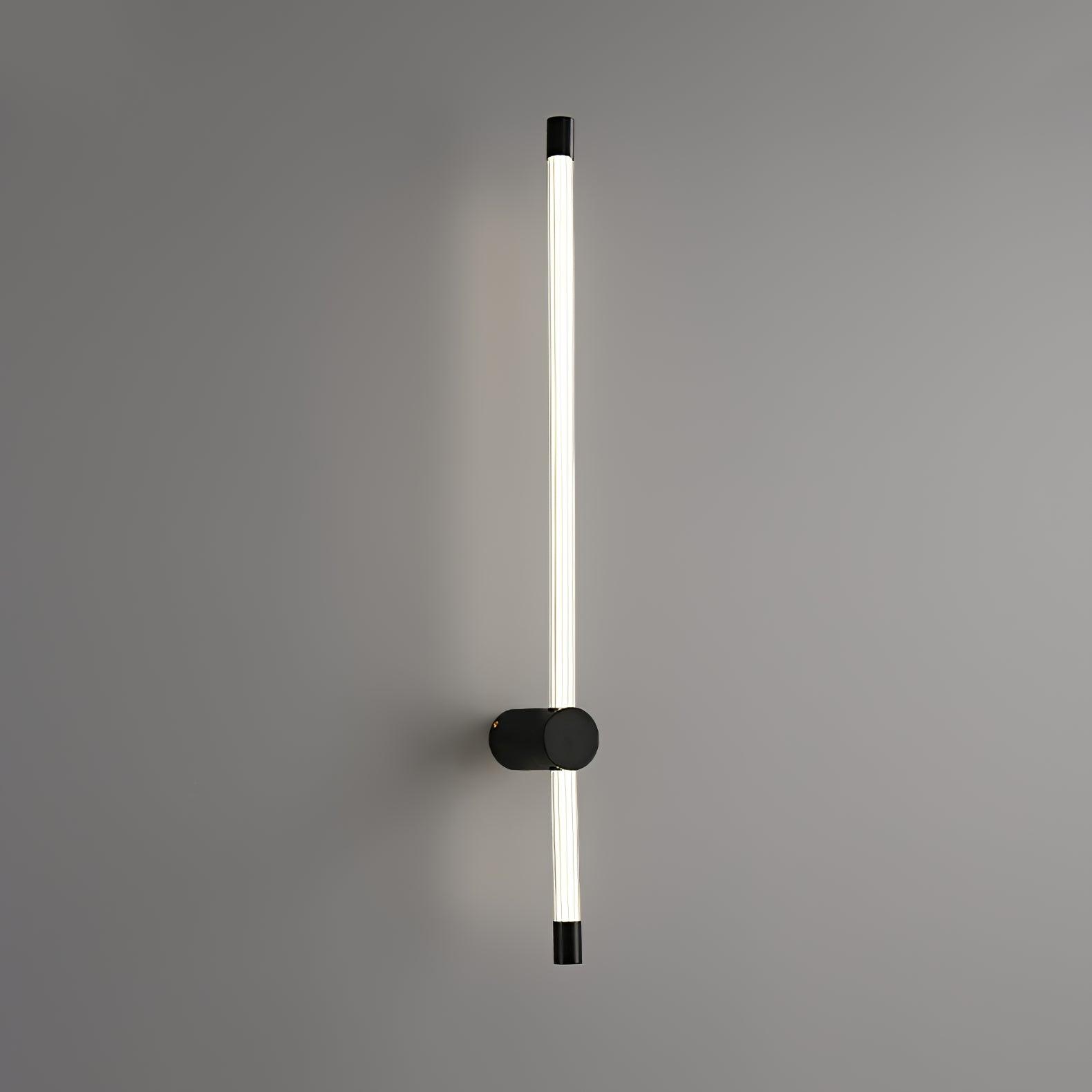 Linear LED wall sconce throwing a clean vertical line of light
