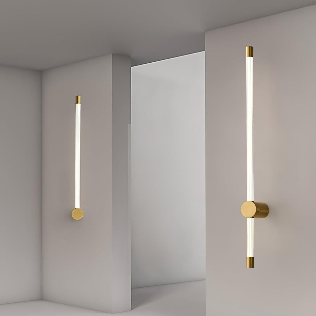 Linear LED wall sconce glowing warm above a side table