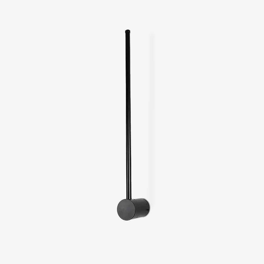 Slim tube wall light glowing warm against a plain wall