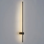 Ultra-slim LED tube light mounted vertically on a wall
