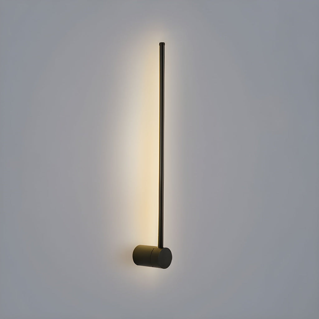 Slim linear LED wall light glowing as a clean line of light