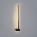 Slim linear LED wall light glowing as a clean line of light