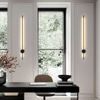 Black linear LED tube wall light shown in graphic minimal detail