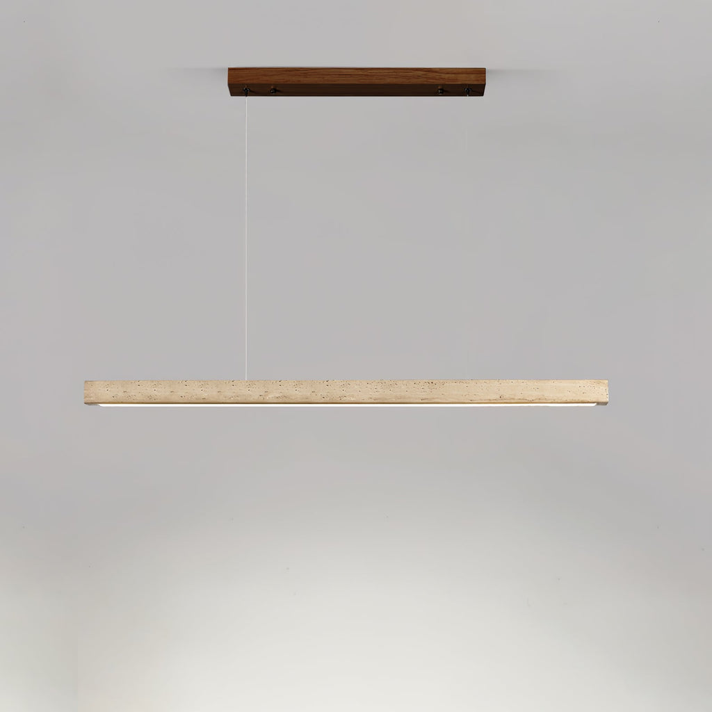 This Clérachic pendant's dark walnut canopy and travertine bar glow warm along the underside, shown on a grey backdrop.