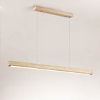 Shown against a warm beige backdrop, this Clérachic pendant's travertine bar glows along its underside.