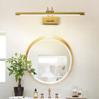 Two-tone bronze and brass vanity light mounted above a sink
