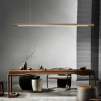 Linear wooden pendant light close detail of the lit underside