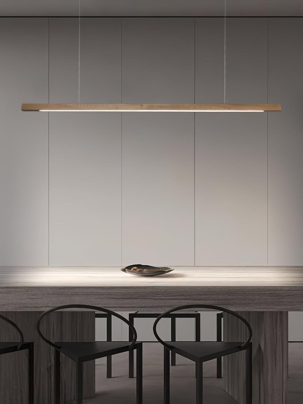 Wooden pendant light linear body suspended in a styled interior
