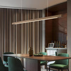 Linear wooden pendant light run lined up over a long table