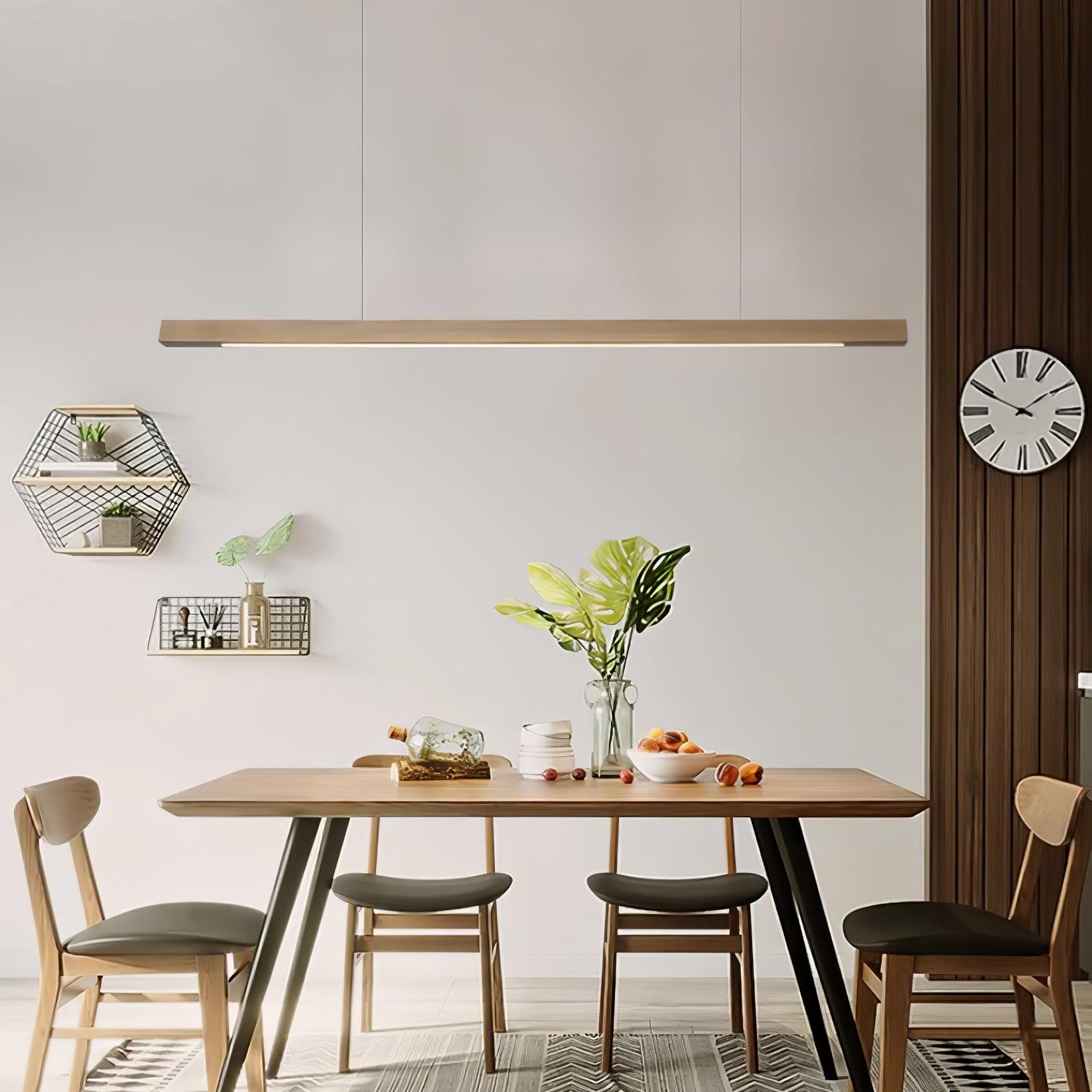 Wooden linear pendant light glowing softly in a warm room