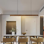 Wooden pendant light linear shade glowing in a calm interior