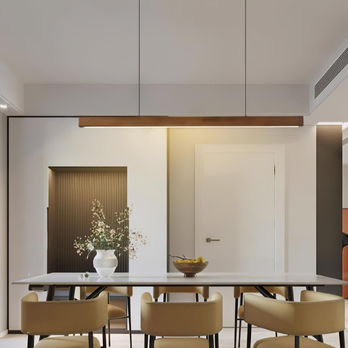 Wooden pendant light linear shade glowing in a calm interior