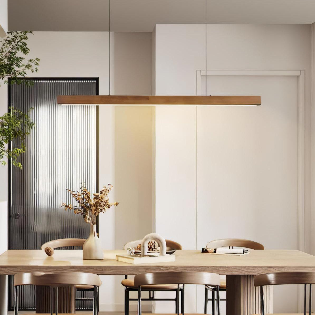 Linear wooden pendant light over a table in a cozy setting