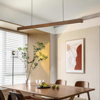 Wooden linear pendant light with warm grain and soft glow