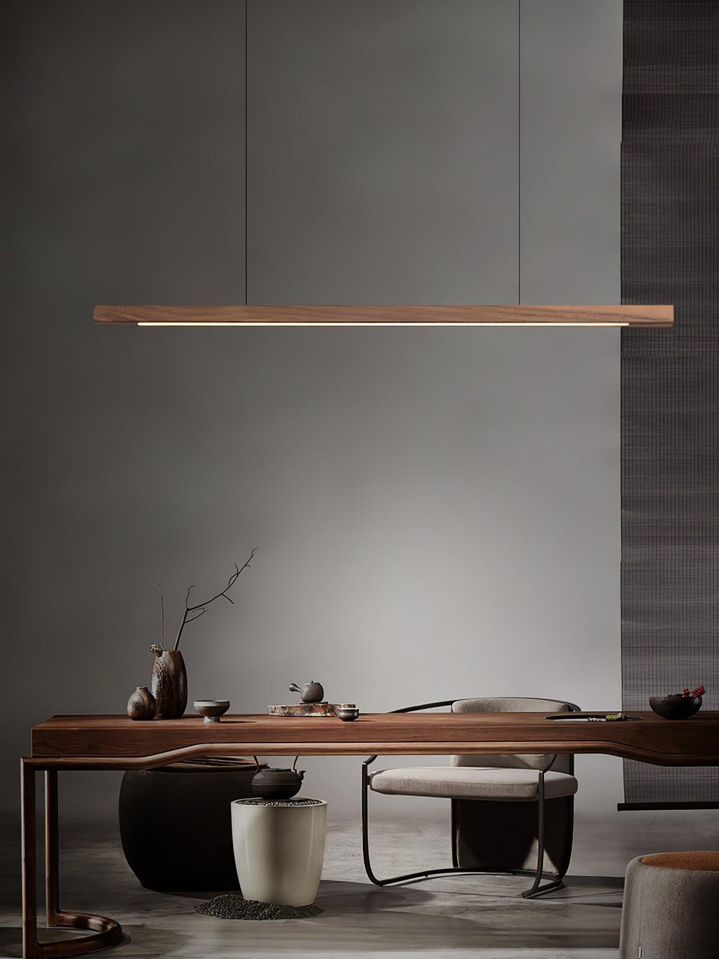 Wooden pendant light linear fixture lit above a worktop