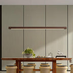 Linear wooden pendant light with soft diffused glow underneath