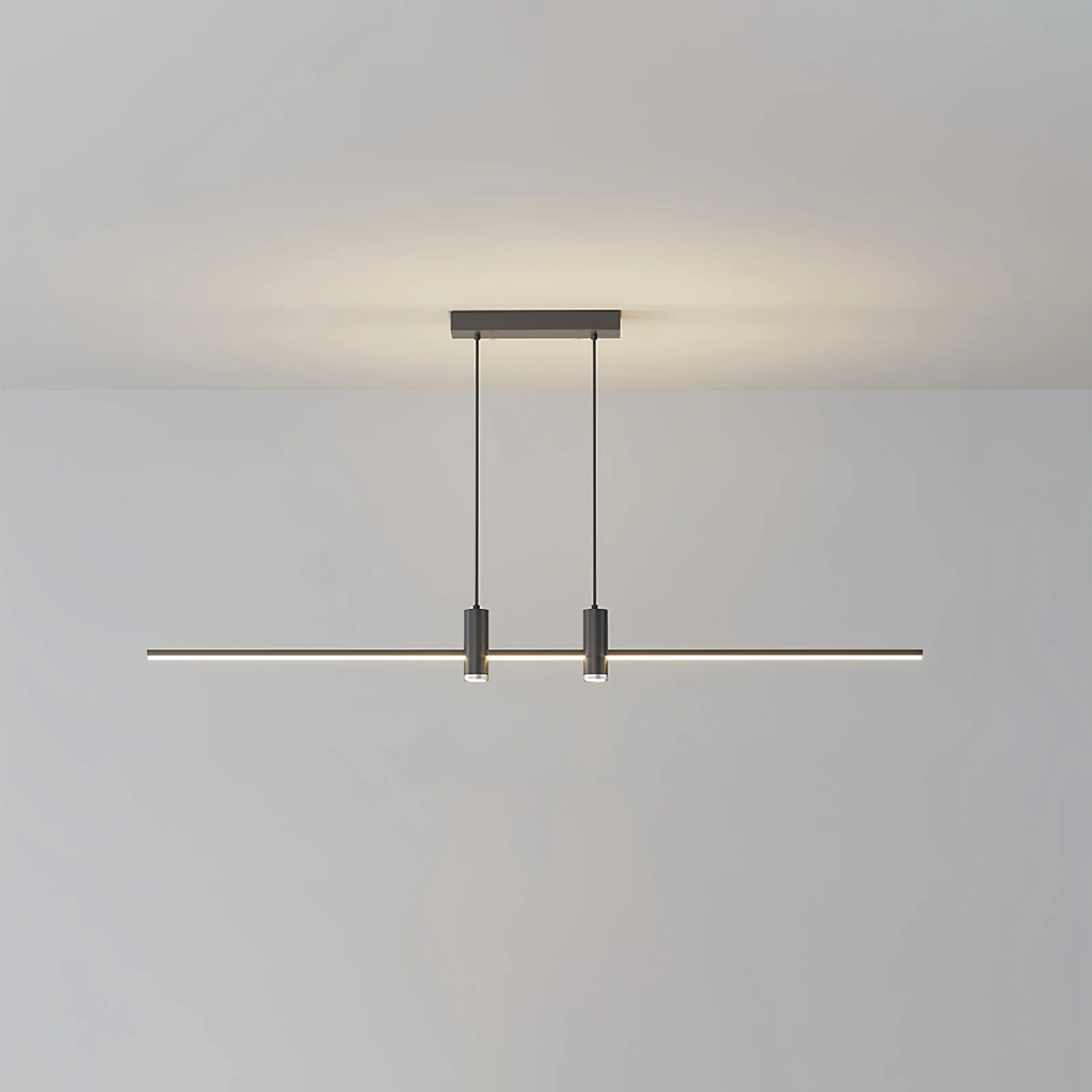 Linear bar pendant light hung low over a kitchen island
