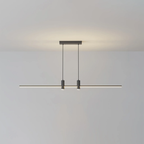 Linear bar pendant light hung low over a kitchen island