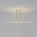 Linear bar pendant light glowing edge to edge over a counter