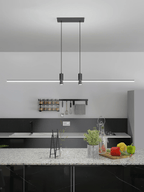 Linear bar pendant light hung above an island in a kitchen