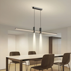 Linear bar pendant light fixture detail on a plain backdrop