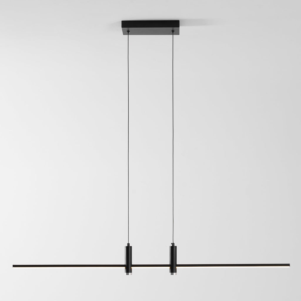 Linear bar pendant light suspended over a counter surface
