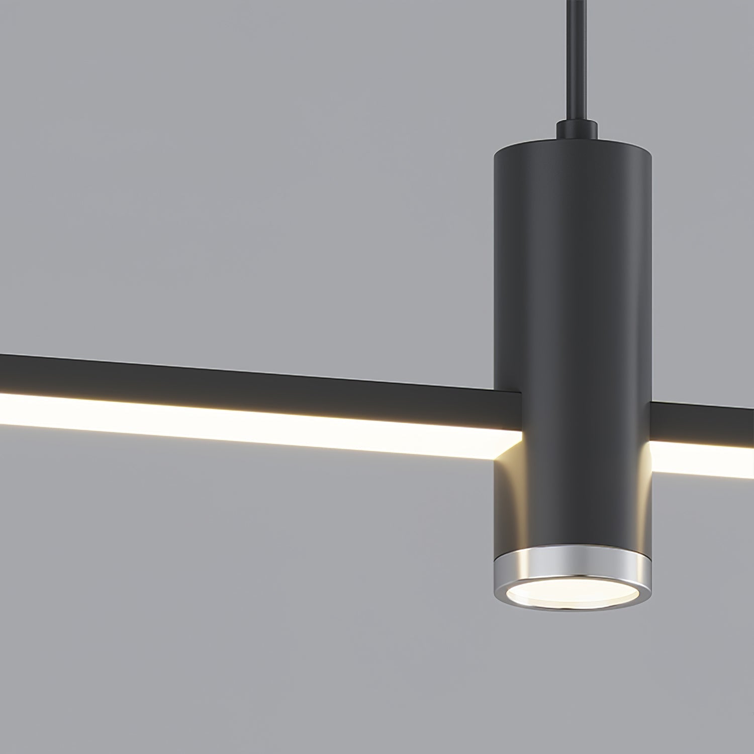 Linear bar pendant light fixture shown from below lit