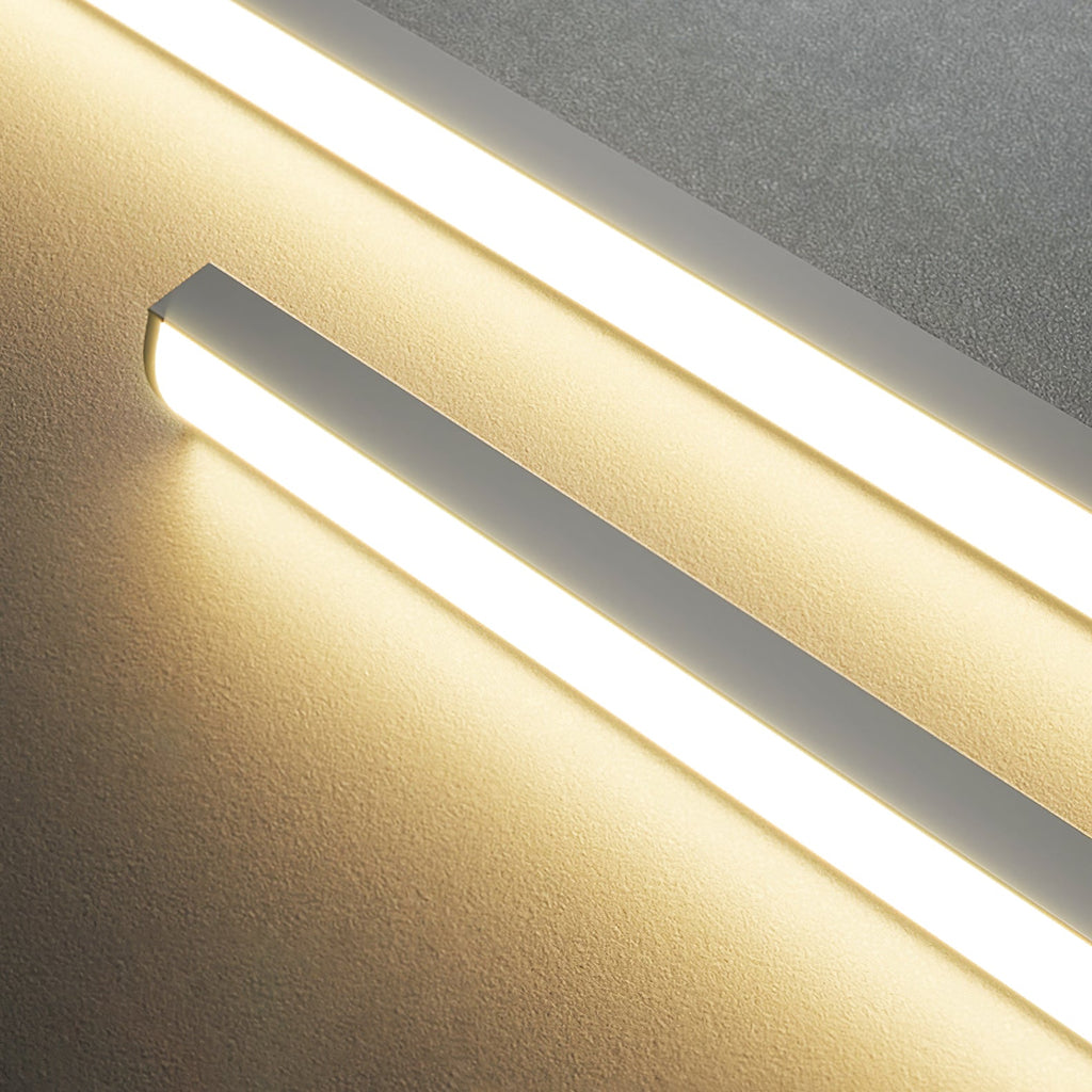 Linear bar pendant light slim body glowing above a table