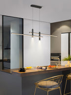 Linear pendant light casting even light across a dining table