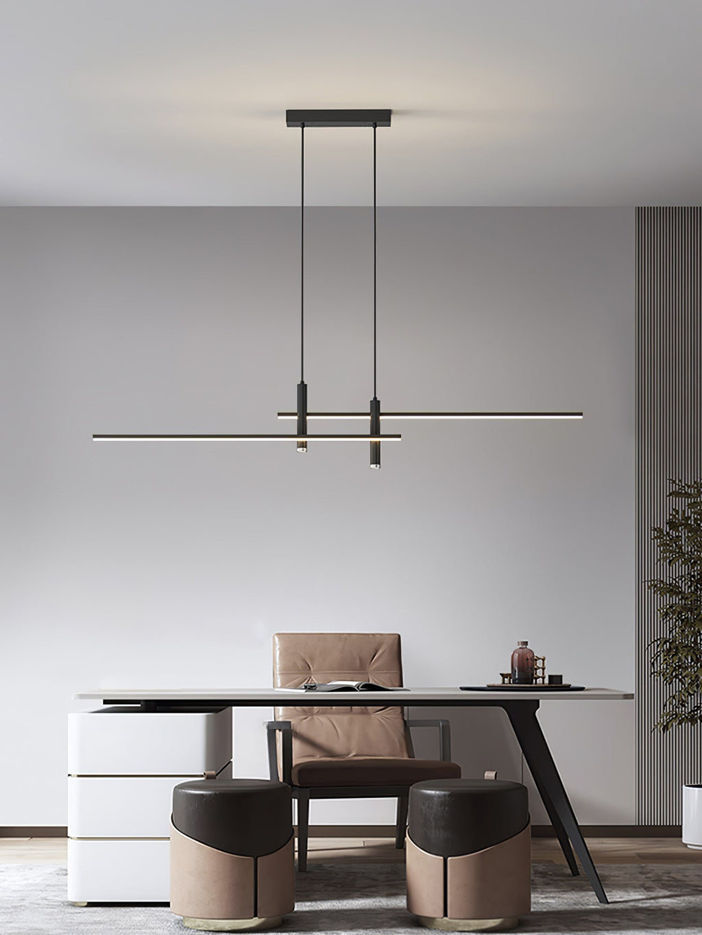 Linear pendant light glowing over an island in a styled kitchen