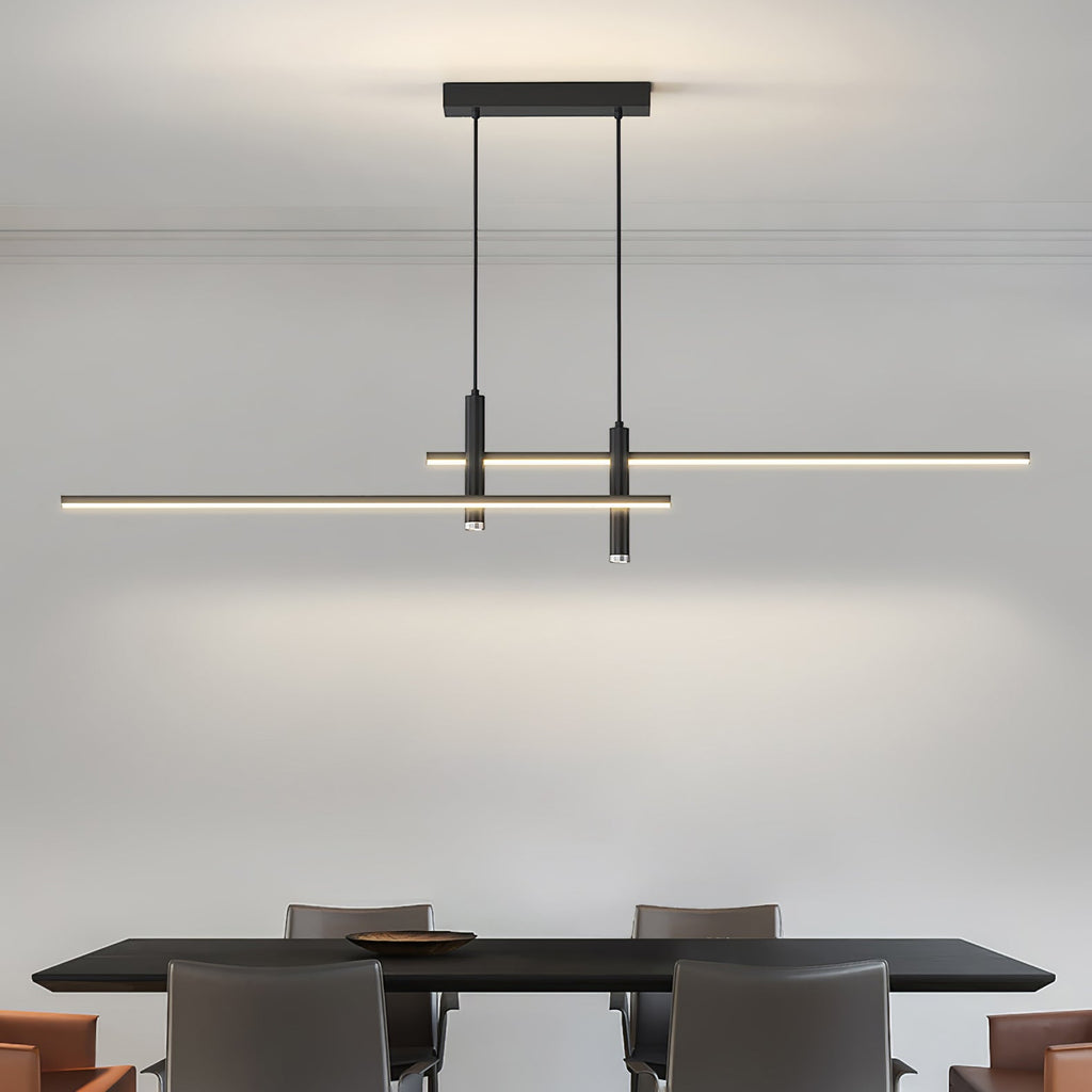 Linear pendant light lit warmly above a dining table setting