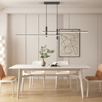 Linear pendant light glowing softly over a dining table