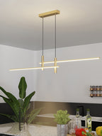 Linear pendant light with warm glow in a styled interior