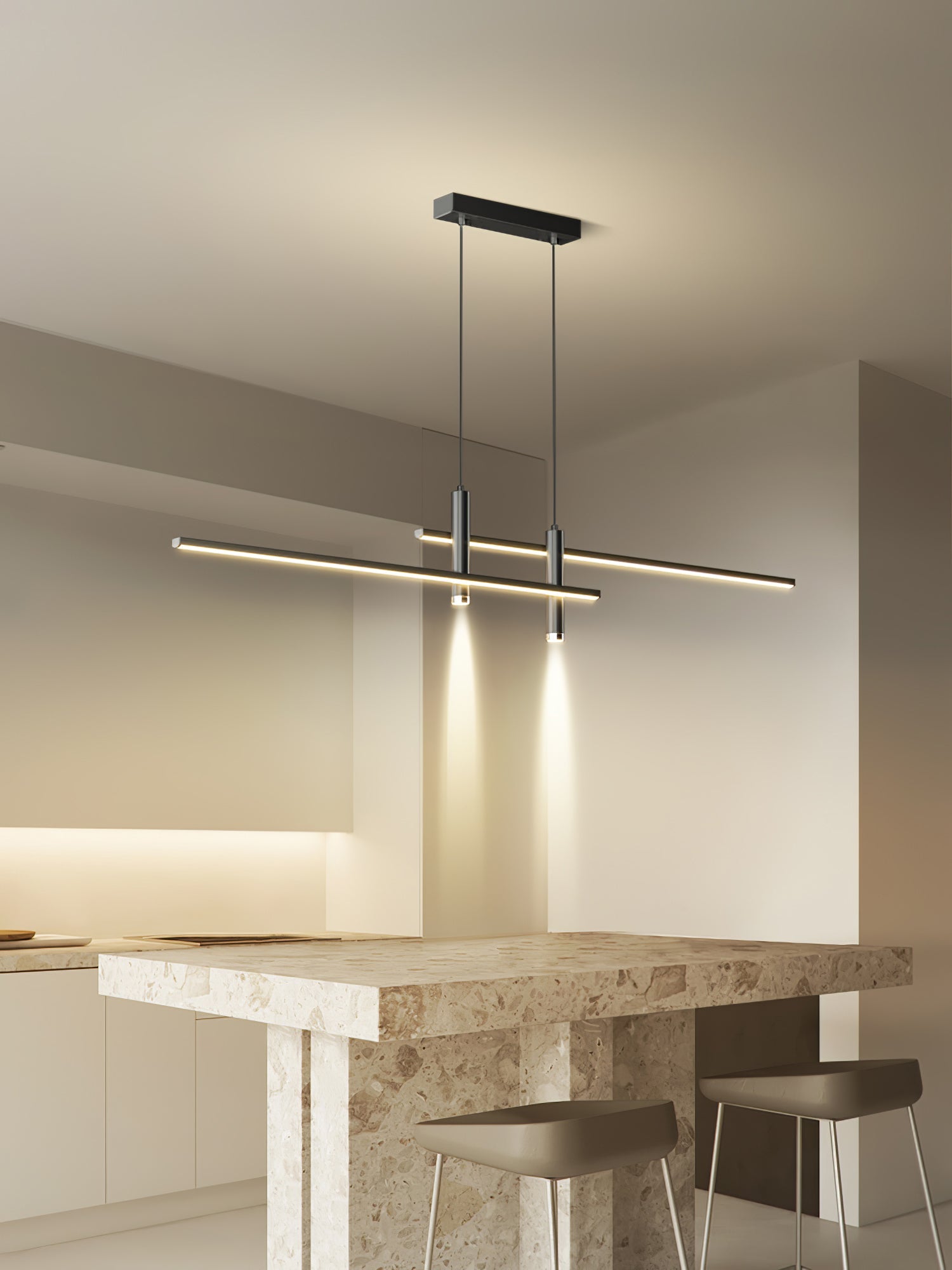 Linear pendant light over a table in a softly lit room