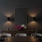 Two Clérachic marble table lamps flank a gilt mirror on a dark sideboard, with roses and lilies set between them in a dining room.