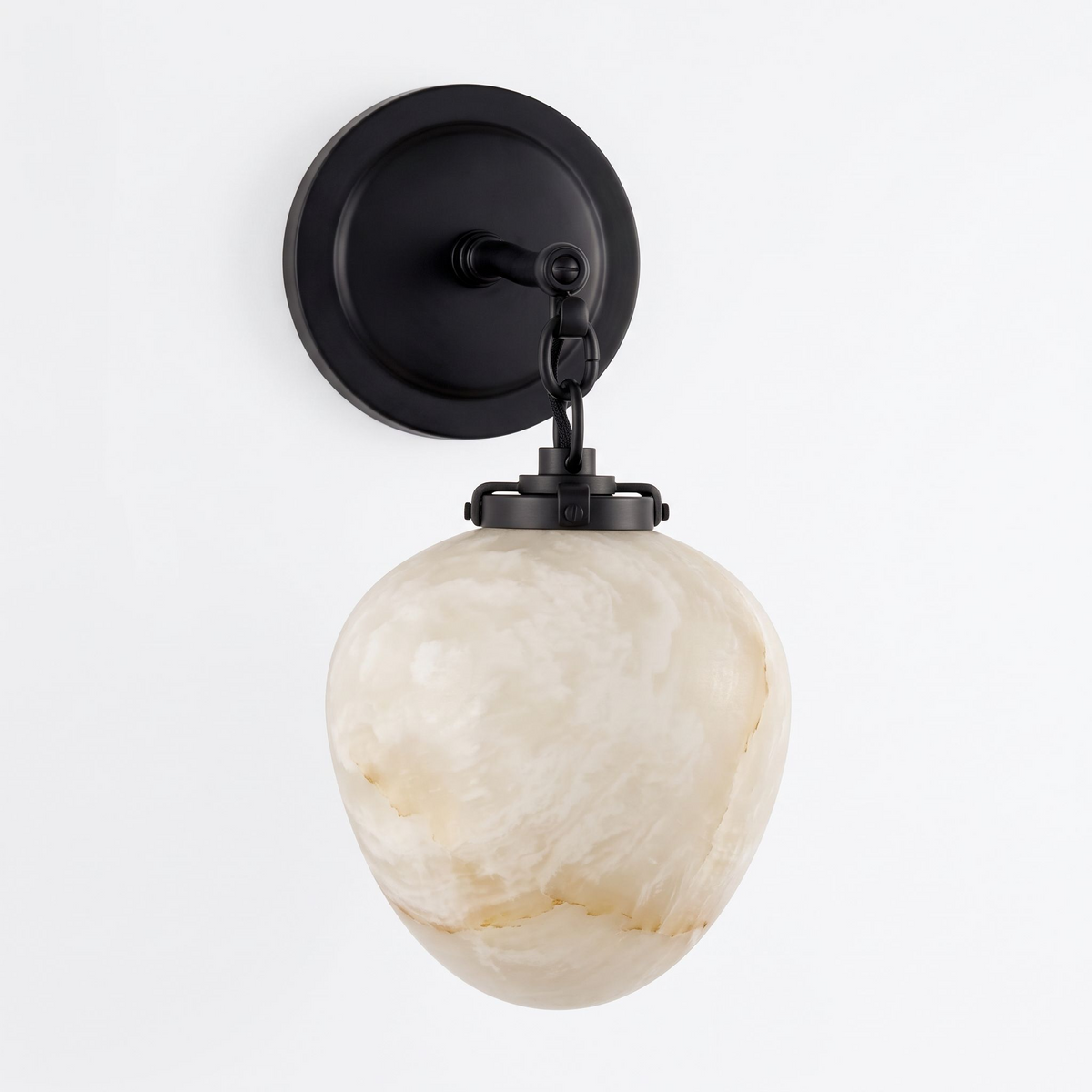 Studio shot of this Clérachic wall sconce in black finish, its teardrop alabaster shade suspended from a chain.
