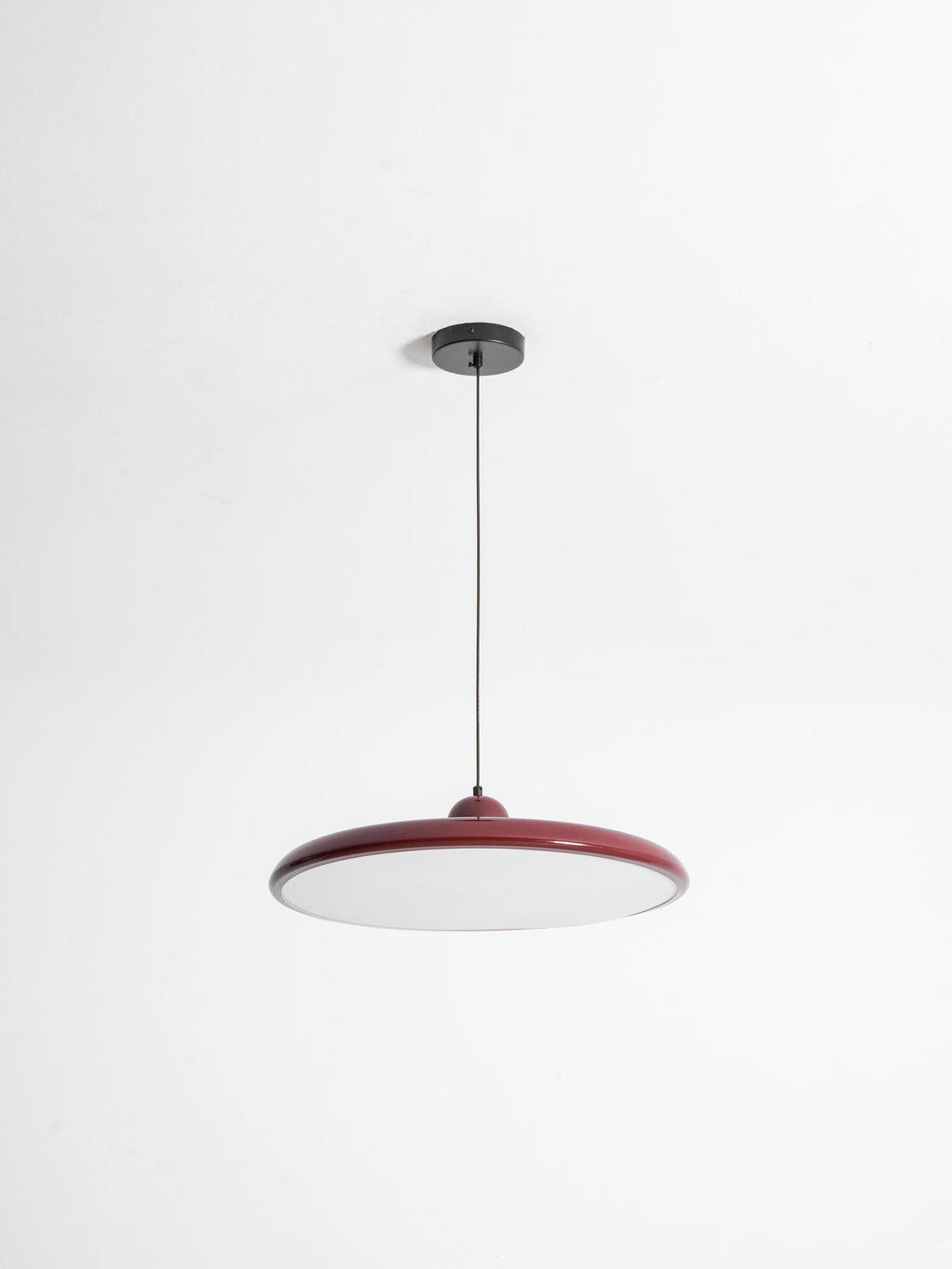 Round disc pendant light angled detail of the disc shade