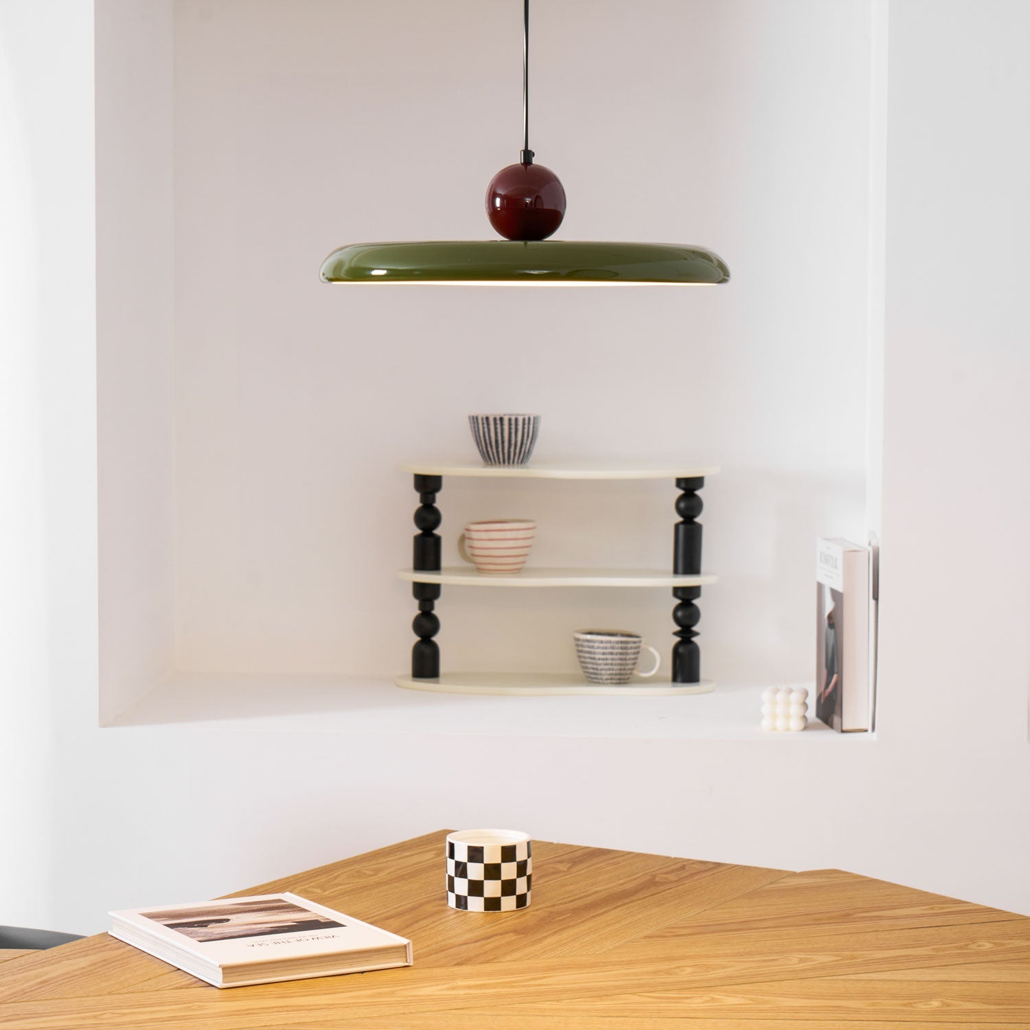 Disc pendant light glowing above a relaxed seating area