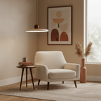 Disc pendant light with warm glow seen from a low angle